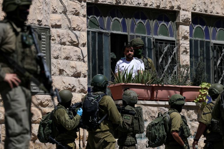 reuters_6aa21782-1789007746 Israeli soldiers detain a Palestinian man, as they conduct raid in Anata, in the Israeli-occupied West Bank, September 8, 2026. REUTERS/Ammar Awad REFILE - CORRECTING ACTION FROM "ISRAELI SOLDIERS TALK TO A PALESTINIAN MAN" TO "ISRAELI SOLDIERS DETAIN A PALESTINIAN MAN". TPX IMAGES OF THE DAY