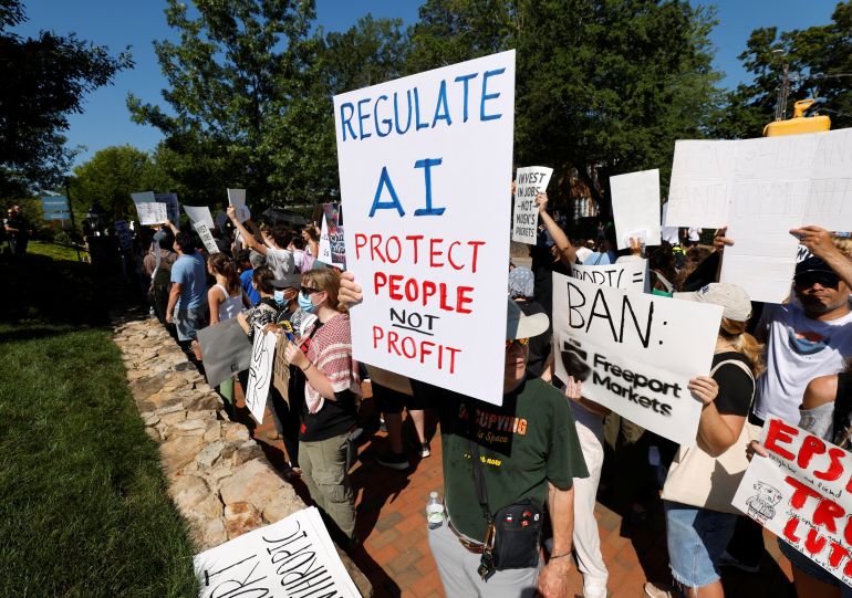 A demonstrator holds a sign calling for regulation of artificial intelligence during a protest outside the G20 Innovation Ministerial summit, in Chapel Hill, North Carolina, U.S., September 2, 2026. REUTERS/Jonathan Drake