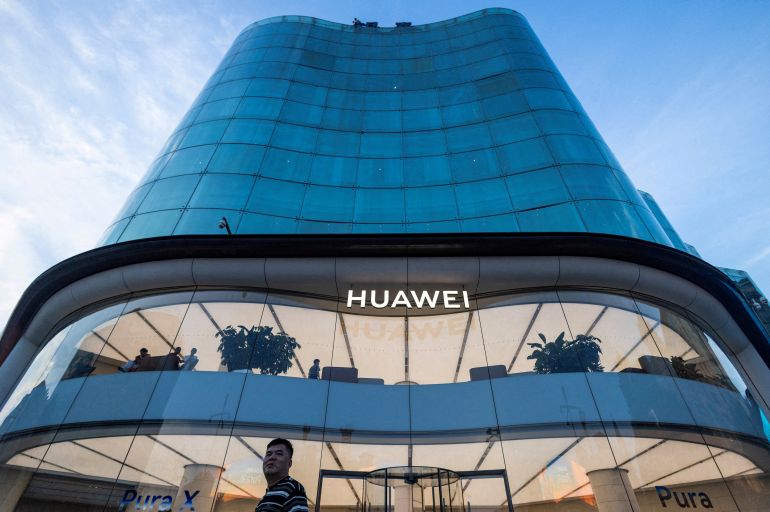 reuters_6aa65024-1789284388 FILE PHOTO: FILE PHOTO: A man looks on as he walks next to a Huawei store in the Wangfujing street in Beijing, China, July 8, 2026. REUTERS/Maxim Shemetov/File Photo/File Photo