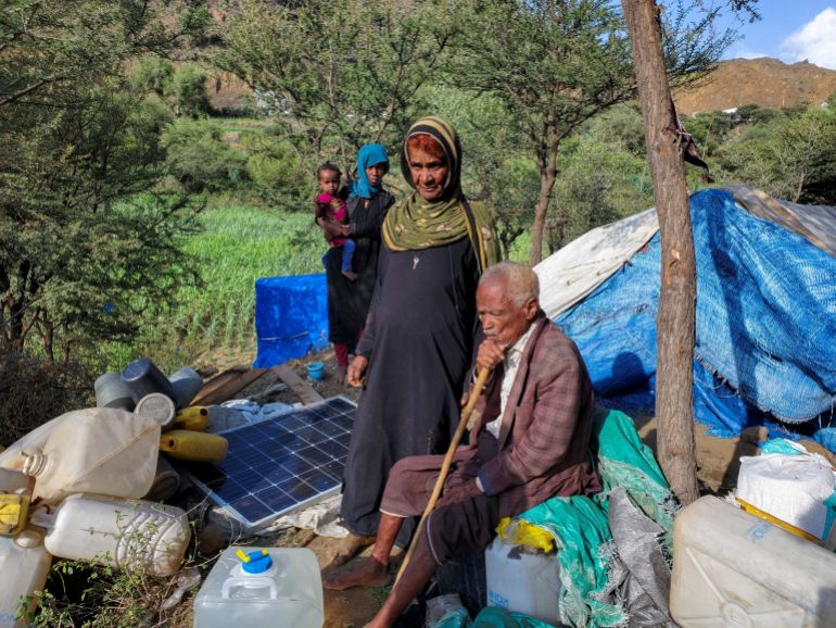 Abdullah Qayid and his wife take refuge at makeshift camp for internally displaced people, after fleeing their home during clashes between Iran-aligned Houthi fighters and Saudi-backed Yemeni government forces, in Taiz province, Yemen September 13, 2026. Picture taken with a mobile phone. REUTERS/Stringer REFILE - ADDING INFORMATION