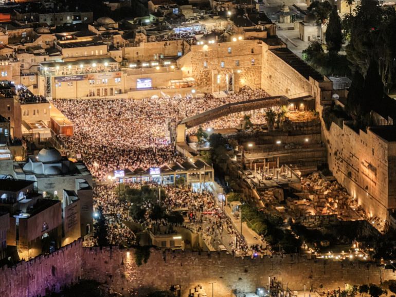 reuters_6aaf88f7-1789888759 A drone view of Jewish worshippers taking part in Slichot, a prayer in which Jews offer repentance and ask God to forgive their sins, ahead of Yom Kippur, the Jewish day of atonement and the holiest day in the Jewish calendar, at the Western Wall in Jerusalem's Old City, September 18, 2026. REUTERS/Ilan Rosenberg
