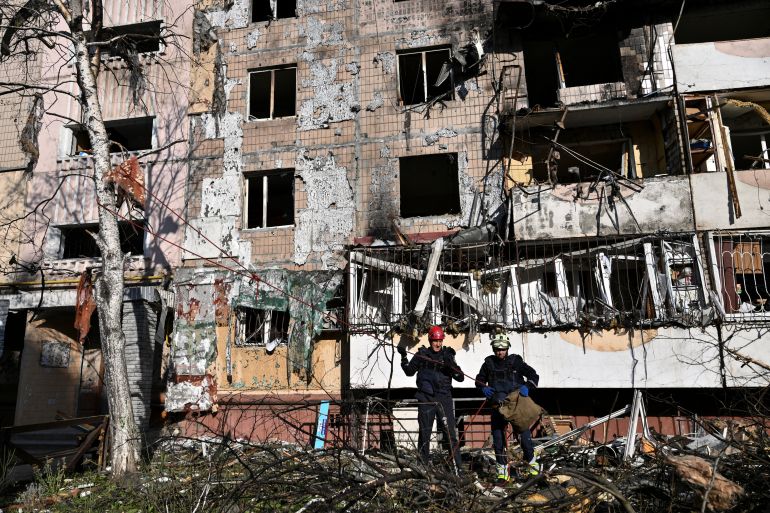 reuters_6ab1ee15-1790045717 Rescuers work in front of an apartment building which was damaged by an overnight Russian drone strike, amid Russia's attack on Ukraine, in Zaporizhzhia, Ukraine September 21, 2026. REUTERS/Stringer