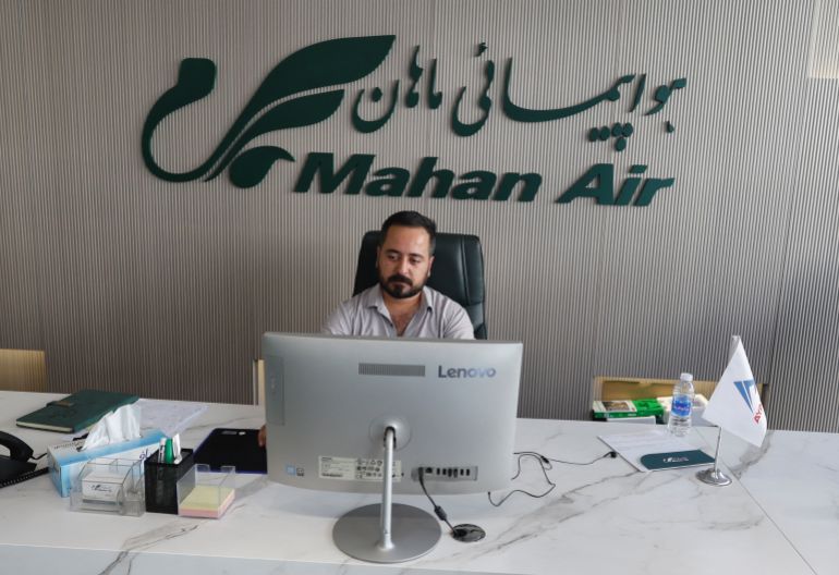 reuters_6abab95c-1790622044 An employee works at the office of Iran's Mahan Air in Erbil, Iraq, September 22, 2026. The United States on Thursday imposed new Iran-related sanctions targeting networks that support Mahan Air, which Washington says transports personnel of Iran's Revolutionary Guards as well as weapons and drones. REUTERS/Khalid Al-Mousily