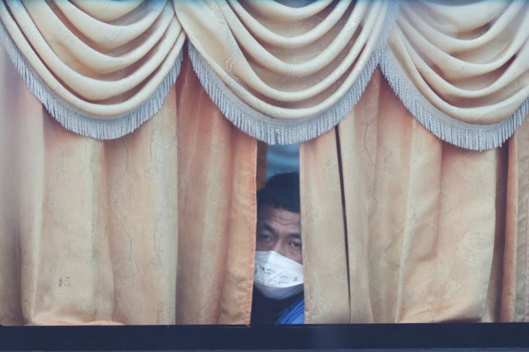 reuters_6abbc956-1790691670 A Myanmar national to be repatriated from Malaysia sits inside a bus, at Lumut, Malaysia, September 29, 2026. REUTERS/Hasnoor Hussain