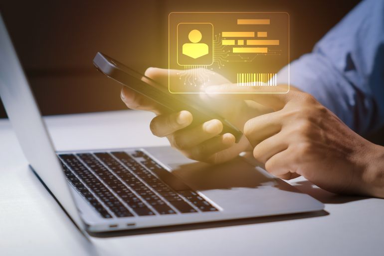 shutterstock_2665989743-1780223884 Digital identification or digital ID. Businessman and hand touch virtual screen of digital identification card to accessing databases by digital identity for cyber security. Employee badge.