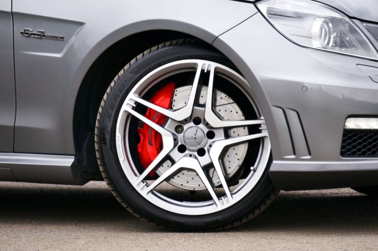 Detailed close-up of a Mercedes Benz tire and alloy wheel, highlighting design and branding.