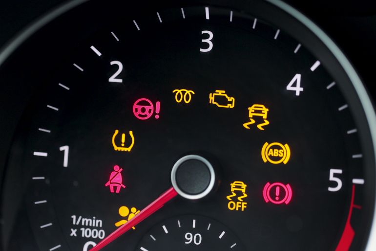 24s6d841as3d-1791451863-1 Many different car dashboard lights with warning lamps illuminated. Light symbol that pops up on dashboard when something goes wrong with the engine. adobe stock
