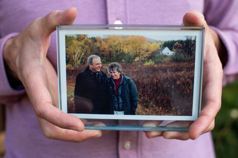 2nam-1791185279 EL CERRITO, CA - NOVEMBER 11: James Vlahos, CEO of Hereafter.AI, holds a photograph of his parents, John and Martha Vlahos, outside his home on November 11, 2022 in El Cerrito, California. James created a chatbot or Dadbot as he calls it which allowed him to reconnect with his deceased father, the original motivation for starting Hereafter.AI. The app reconnects people with their dead loved ones through virtual reality by taking users through an interview process before theyve died, prompting them to recollect stories and memories that are then recorded. After theyve passed, family members can ask questions, and the app responds in the deceaseds voice using the accumulated interview information, almost like its engaging in a conversation. (Photo by Marlena Sloss for The Washington Post via Getty Images)