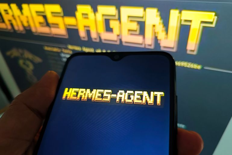 32-1791550616 SUQIAN, CHINA - MAY 8, 2026 - A netizen is checking the Hermes-Agent logo on his mobile phone and Hermes-Agent website on his computer in Suqian City, Jiangsu Province, China on May 8, 2026. (Photo credit should read CFOTO/Future Publishing via Getty Images)