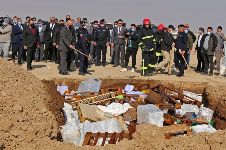 334a8gj-highres Government officials gather to destroy nearly six tons of drugs, some of which had been in storage for more than a decade, in Baghdad's Nahrawan area on December 18, 2022. (Photo by Sabah ARAR / AFP)