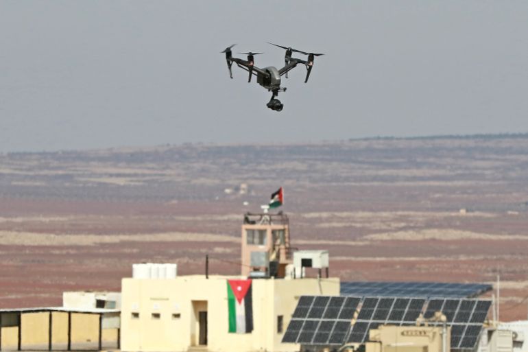 444444-31-1692206836 A picture taken during a tour origanized by the Jordanian Army shows a drone flying over an observation post along the border with Syria, on February 17, 2022. - Drug trafficking from Syria into Jordan is becoming "organised" with smugglers stepping up operations and using sophisticated equipment including drones, Jordan's army said, warning of a shoot-to-kill policy. Since the beginning of this year, Jordan's army has killed 30 smugglers and foiled attempts to smuggle into the kingdom from Syria 16 million Captagon pills -- more than they seized in the whole of 2021 -- the military said. (Photo by Khalil MAZRAAWI / AFP)