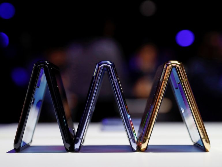 47ae0509-a559-45fc-bf6d-ed46661243e7 A trio of Samsung Galaxy Z Flip foldable smartphones is seen during Samsung Galaxy Unpacked 2020 in San Francisco, California, U.S. February 11, 2020. REUTERS/Stephen Lam