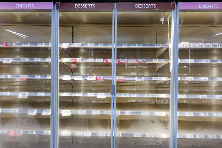 This photograph shows empty fresh-food refrigerators at an Intermarché supermarket in Névez, western France, on October 12, 2026, following a cyberattack affecting the French supermarket chains Intermarché and Cooperative U that caused their refrigerators to defrost. Some 150 to 200 Intermarché stores were targeted in the attack on October 12, 2026, along with nearly 100 Coopérative U outlets, the retailers said. BFM TV reported that rival giant E. Leclerc was also affected, with hackers "managing to remotely trigger the forced defrosting of refrigeration systems in numerous stores." (Photo by Fred TANNEAU / AFP via Getty Images)