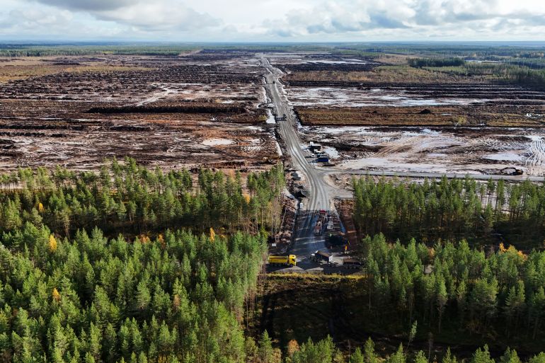 7468s34y1s-1791180324 An aerial view shows the site where Google's data centre is set to be built in Muhos, Finland, on September 29, 2026. In the northern Finnish town of Muhos, 36-year-old farmer Joni Pitkanen is preparing for life with a new neighbour -- just kilometers away tech giant Google is planning to build new data centres. The planned data centres are part of an announced 13-billion-euro ($15-billion) investment in Finland over the next two years -- the US tech giant's single biggest investment in Europe. A few kilometers down the gravel road that passes by Pitkanen's farm, the forest has already been cut down on land acquired by Google, with excavators now clearing the ground and rumbling trucks shuttling back and forth to the construction area located next to major power lines. (Photo by Alessandro RAMPAZZO / AFP)