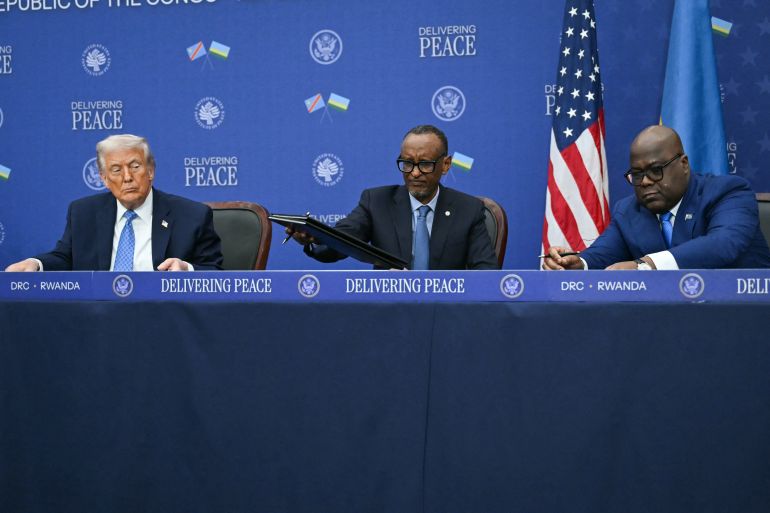 afp_693260cb286f-1764909259 US President Donald Trump (L) participates in the signing ceremony of a peace deal with the President of Rwanda Paul Kagame (C) and the President of the Democratic Republic of the Congo Felix Tshisekedi (R) at the United States Institute of Peace in Washington, DC, on December 4, 2025.