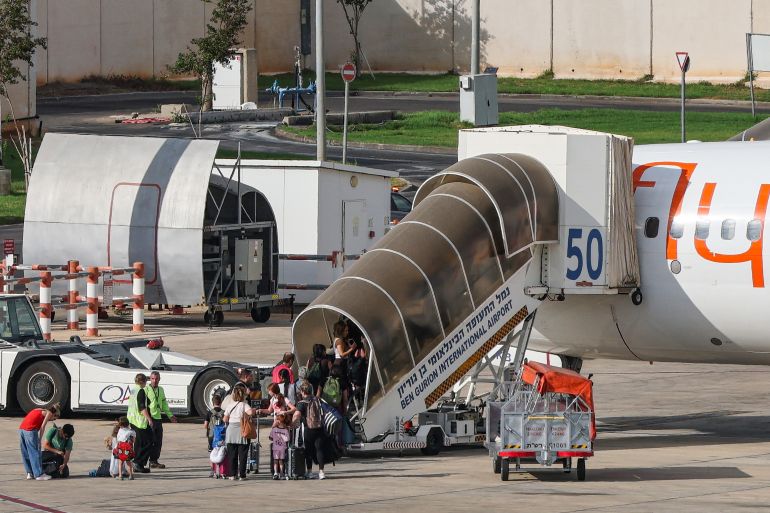 afp_6abd45e35c78-1790789091 Passengers board a flydubai flight, bound for Dubai, before taking off from Ben Gurion Airport near Tel Aviv on September 30, 2026.