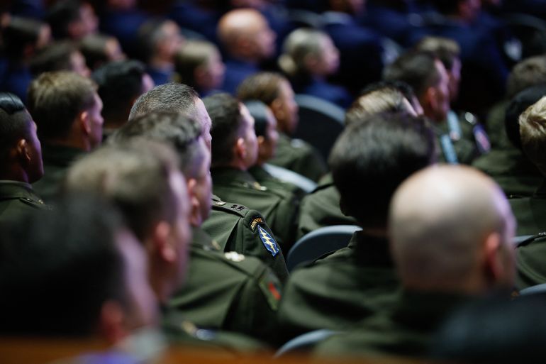 afp_6abde65183f8-1790830161 Members of the US military listen as US Secretary of Defense Pete Hegseth delivers the State of the Force address in Quantico, Virginia, on September 30, 2026.