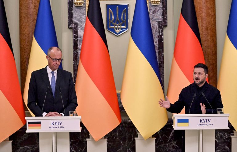 Ukraine's President Volodymyr Zelensky (R) and Germany's Chancellor Friedrich Merz hold a press conference in Mariinsky Palace following talks in Kyiv on October 4, 2026, amid the Russian invasion of Ukraine. (Photo by Sergei SUPINSKY / AFP)
