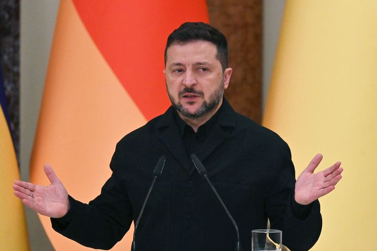 Ukraine's President Volodymyr Zelensky speaks during a press conference following talks with Germany's Chancellor in Mariinsky Palace following talks in Kyiv on October 4, 2026, amid the Russian invasion of Ukraine. (Photo by Sergei SUPINSKY / AFP)