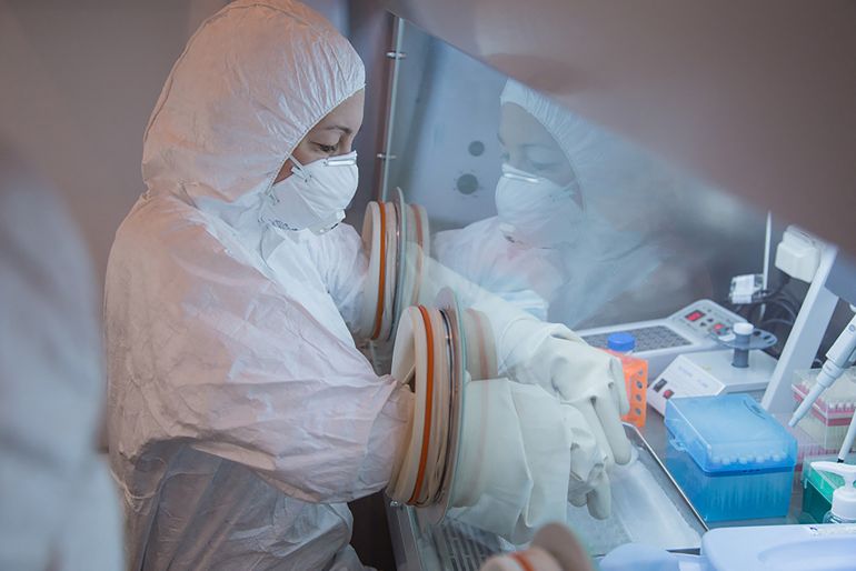 In this undated handout picture released by the Irkutsk Antiplague Research Institute, a specialist works in a laboratory as part of anti-epidemic measures during the 2019 Winter Universiade in Krasnoyarsk. (Photo by Handout / Irkutsk Antiplague Research Institute / AFP) / RESTRICTED TO EDITORIAL USE - MANDATORY CREDIT "AFP PHOTO / IRKUTSK ANTIPLAGUE RESEARCH INSTITUTE" - HANDOUT - NO MARKETING NO ADVERTISING CAMPAIGNS - DISTRIBUTED AS A SERVICE TO CLIENTS