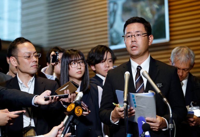 afp_6ac650f6e5be-1791381750 Okinawa governor Genta Koja (R) speaks to reporters after his meeting with Japanese Prime Minister Sanae Takaichi at the prime minister’s office in Tokyo on October 7, 2026.