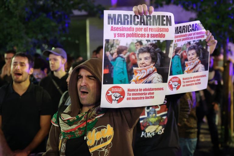 Demonstrators gather after learning that Maricarmen Abascal, the 87-year-old pensioner whose eviction triggered nationwide protests over Spain's chronic housing crisis and a political debate that culminated in early elections, had died in hospital in Madrid on October 7, 2026.