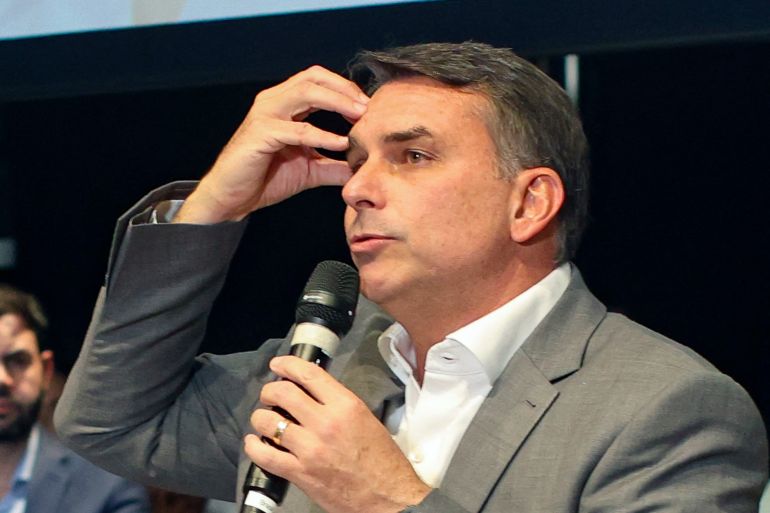 Brazil's right-wing senator and presidential candidate for the Liberal Party (PL) Flavio Bolsonaro gestures while speaking during a PL event in Brasilia, on October 7, 2026.