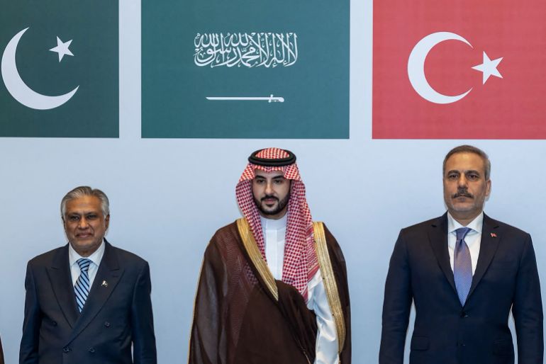 afp_6ac76dcecc6c-1791454670 This handout photograph taken and released by the Turkish Foreign Ministry on October 5, 2026 shows (L-R) Pakistan’s Deputy Prime Minister and Minister for Foreign Affairs Ishaq Dar, Saudi Defence Minister Prince Khalid bin Salman Al Saud and Turkish Foreign Minister Hakan Fidan posing during a meeting of the Strategic Political and Defense Committee, established under the Mecca Joint Defense Agreement, in Riyadh.
