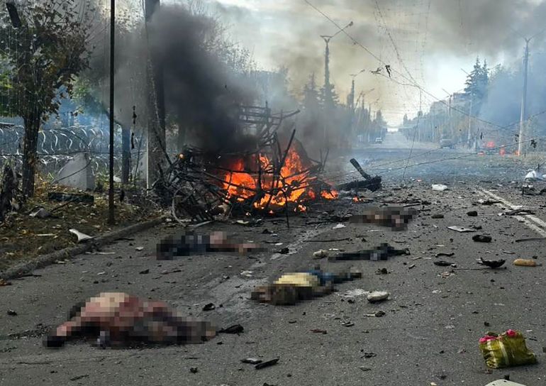 afp_6ac77300edcc-1791456000 EDITORS NOTE: Graphic content / This handout photograph taken and released by the Donetsk Region Prosecutor's Office on October 8, 2026, shows bodies lying on the road after two passenger buses were struck by projectiles in Kramatorsk, near the frontline in eastern Ukraine, amid the Russian invasion of Ukraine.