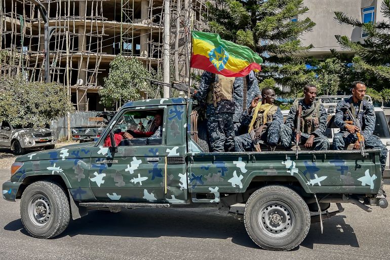 afp_6acd11e7969e-1791824359 Members of the Ethiopian Federal Police (EFP) patrol aboard a pickup truck as they resume operations after federal forces pushed back the rebel Tigray People's Liberation Front (TPLF) in Mekelle on October 9, 2026.