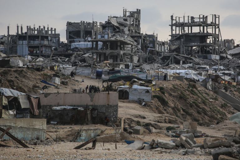 afp_6acde89feb3f-1791879327 This photograph shows makeshift shelters erected amid the ruins of destroyed buildings in Beit Lahia in the northern Gaza Strip on October 12, 2026.