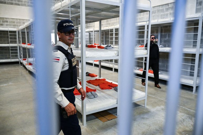 A police officer stands guard at the High-Security Center for the Containment of Organized Crime (CACCO) during its inauguration in Alajuela, Costa Rica, on October 14, 2026.