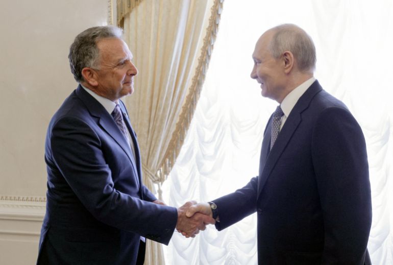 In this pool photograph distributed by the Russian state agency Sputnik, Russia's President Vladimir Putin (R) greets US special envoy Steve Witkoff (L) prior to their meeting in Saint Petersburg on October 21, 2026.