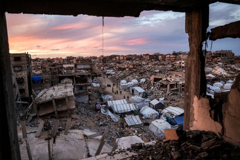 Tents sheltering people displaced by war are pictured between the rubble of destroyed buildings in the Jabalia camp for Palestinian refugees in the northern Gaza Strip on October 20, 2026.
