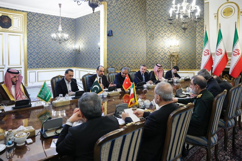 afp_6adf6d611a4f-1793027425 This handout picture provided by the Iranian presidency shows Iran's President Masoud Pezeshkian, Foreign Minister Abbas Araghchi, and National Security Council head Mohsen Rezaei meeting with Saudi Arabia's Defence Minister Prince Khalid bin Salman Al-Saud, Pakistan's army chief General Syed Asim Munir, and Turkey's intelligence chief Ibrahim Kalin in Tehran on October 26, 2026.