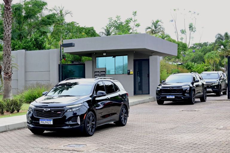 Vehicles belonging to the motorcade of Brazilian right-wing senator and former presidential candidate for the Liberal Party (PL) Flavio Bolsonaro leave his condominium in Brasilia on October 27, 2026.