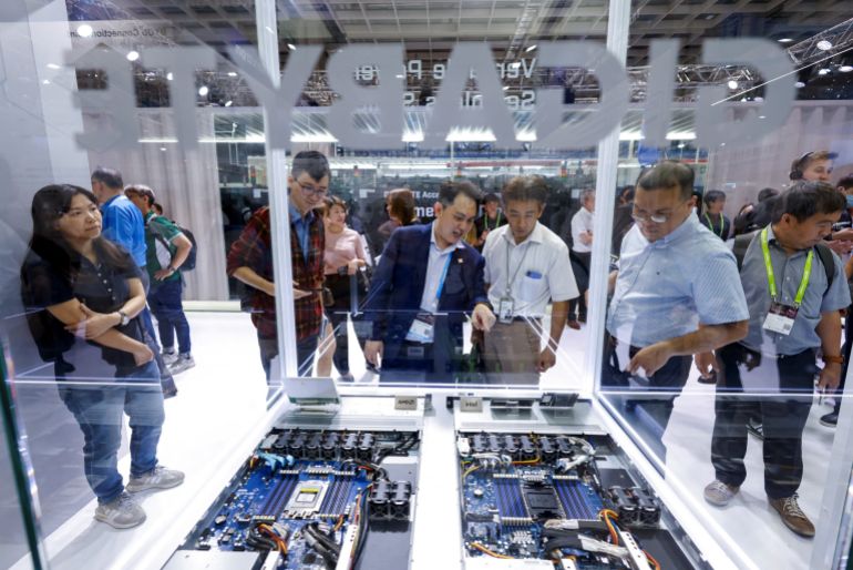 aiii-2-1792524113 People study GPU servers at the Gigabyte Technology booth during the annual Computex trade show in Taipei, Taiwan, June 3, 2026. REUTERS/Ann Wang