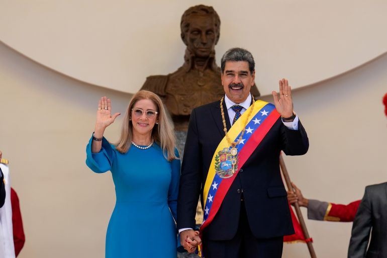 ap_6a98f674f4106-1788409461 FILE - Venezuelan President Nicolas Maduro and his wife Cilia Flores wave after his swearing-in ceremony for a third term at the National Assembly in Caracas, Venezuela, on Jan. 10, 2025. (AP Photo/Ariana Cubillos, File)