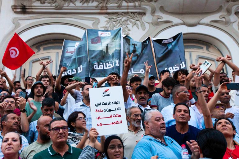ap_6aba22f3d61bb-1790583539 People take part in a demonstration against President Kais Saied in downtown Tunis, Tunisia, Saturday, July 25, 2026. (AP Photo/Ons Abid)