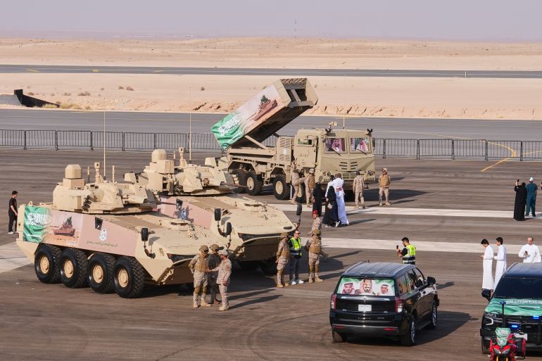 ap_6abfec8ec0481-1790962830 Saudi military personnel and visitors gather near armored vehicles on display before the start of an air show and military parade marking Saudi National Day in Malham, north of Riyadh, Saudi Arabia, Tuesday, Sept. 22, 2026.(AP Photo/Baraa Anwer)