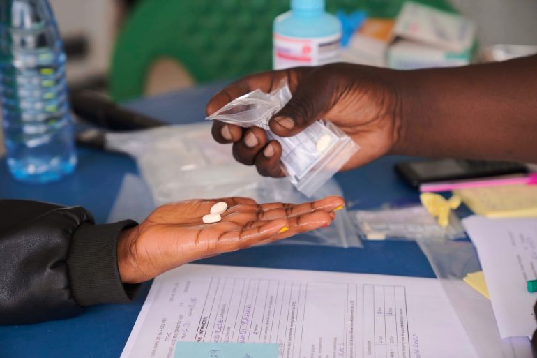 ap_6ac20acad682f-1791101642 Pills are provided to a participant during clinical trials attempting to stop the rare Bundibugyo virus, amidst a deadly Ebola outbreak, in Rwampara Hospital in Ituri, Congo, Thursday, Oct. 1, 2026. (AP Photo/Dieudonne Dirole)