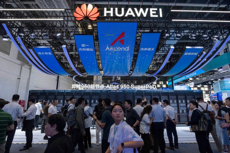 ap_6ac3a3baee6ec-1791206330 Visitors past by the Huawei booth display of the Atlas 950 SuperPoD during the World AI Conference in Shanghai, China on Friday, July 17, 2026. (AP Photo/Ng Han Guan)