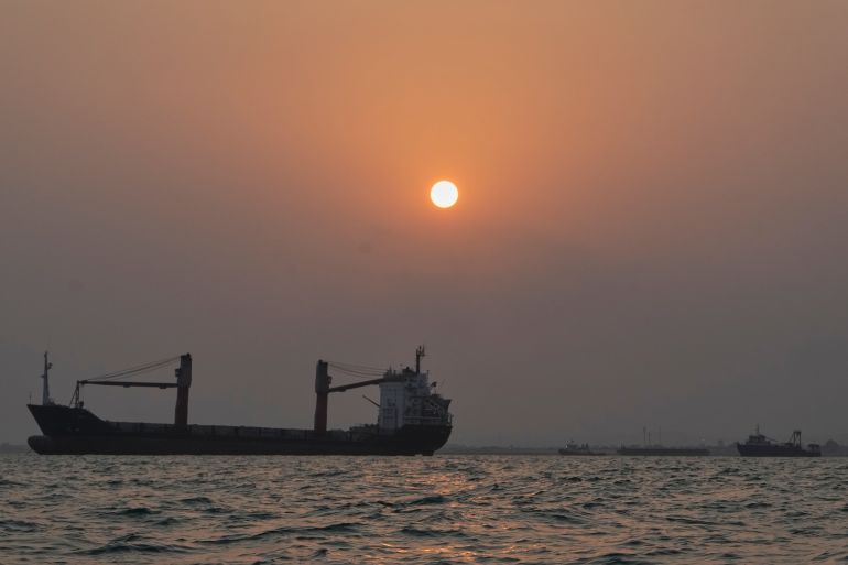 ap_6ac3c51c37898-1791214876-1 The sun sets over commercial vessels anchored in the Strait of Hormuz off Bandar Abbas, Iran, with the city's skyline in the background, Sunday, Sept. 6, 2026. (AP Photo/Vahid Salemi)