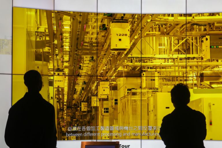People watch an introductory video about silicons, microchips and wafer inside the Museum of Innovation of TSMC or Taiwan Semiconductor Manufacturing Corp, a Taiwanese multinational semiconductor contract manufacturing and design company, in Hsinchu, Taiwan, on Thursday, Jan. 29, 2026. (AP Photo/Daniel Ceng)