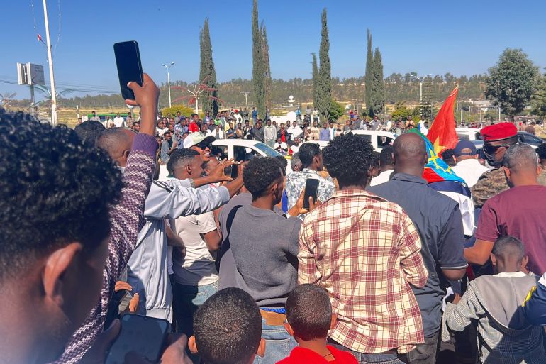 ap_6acd0fae8d1c5-1791823790 In this photo taken with a smartphone, supporters gather to welcome former Tigray leader Getachew Reda in Mekelle, Ethiopia, Sunday, Oct. 11, 2026. (AP Photo/Filmon Equar Hailu)