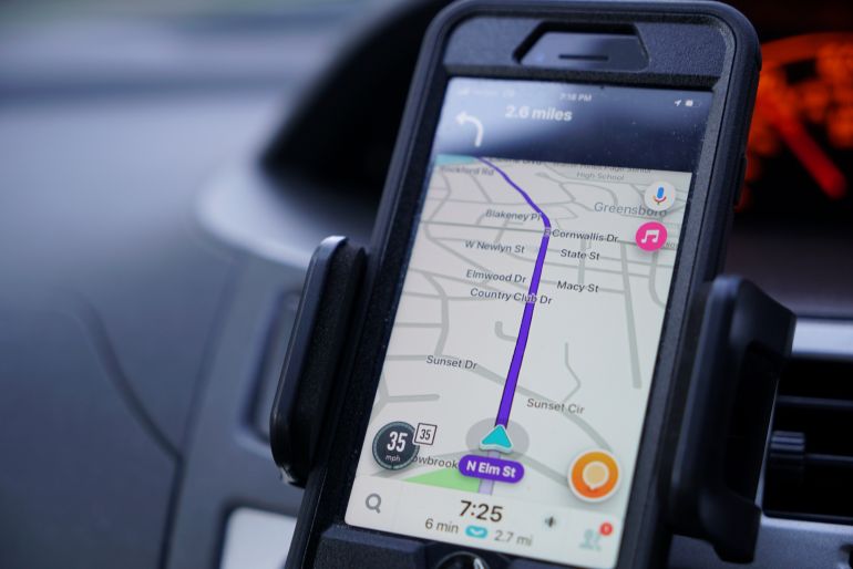 ap_6ad897c3a7c44-1792579523 FILE - Former police data analyst Davin Hall uses the Waze navigation app while driving through Greensboro, N.C., on Wednesday, June 22, 2022. (AP Photo/Allen G. Breed, File)