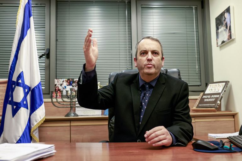 asdasd-1761456399 Gilad Karib, the first liberal rabbi in the Knesset (Israel's parliament) and MK for the Labor Party, speaks during an interview at his office in the Knesset in Jerusalem on November 24, 2021. - Kariv has his sights set on ending the monopoly of the ultra-Orthodox on many aspects of everyday life in the Jewish state. The conservative line of the Jewish religion has in effect laid down the law ever since an accord that ultra-Orthodox rabbis struck with David Ben Gourion when he founded the state of Israel in 1948. (Photo by MENAHEM KAHANA / AFP) (Photo by MENAHEM KAHANA/AFP via Getty Images)