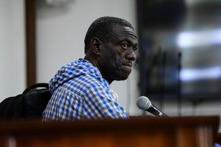 ddd-2-1732094550 Veteran Ugandan opposition leader Kizza Besigye sits in the dock at the courtroom where he was charged with inciting violence during a protest against soaring consumer prices, in Kampala, Uganda May 25, 2022. REUTERS/Abubaker Lubowa