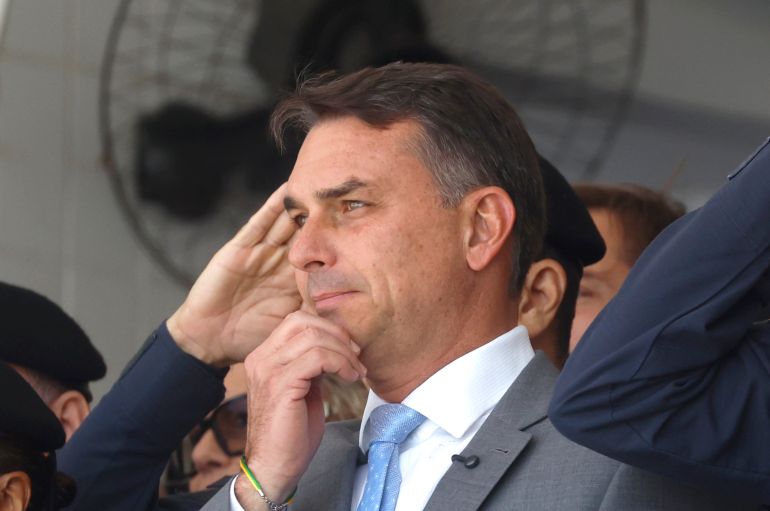 epa_6aba4940b27a-1790593344 epa13262951 Brazilian presidential candidate Flavio Bolsonaro (C) attends the graduation ceremony for the Military Police officer training course in Rio de Janeiro, Brazil, 25 September 2026. General elections will be held in Brazil on 04 October 2026 to elect the president, vice president, and members of the National Congress. EPA/Antonio Lacerda