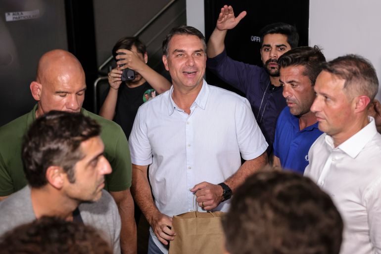 epa13271866 Liberal Party candidate for the presidency of Brazil Flavio Bolsonaro (C) reacts during a campaign event at a Jiu-Jitsu academy in Sao Paulo, Brazil, 29 September 2026. General elections in Brazil are scheduled to take place in October 2026. EPA/Sebastiao Moreira